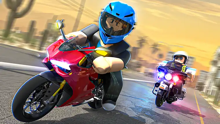 A motorcycle being chased by a police bike along a desert road at sunset